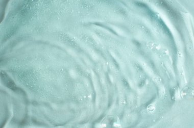 Hava kabarcıklarıyla dolu yeşil şeffaf jel dokusu. Kozmetiğin gelişimi. Kozmetoloji araştırması