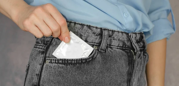 Unrecognizable Woman Puts Condom Her Pocket — Zdjęcie stockowe