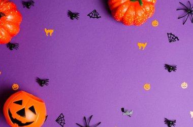 Traditional halloween decorations on purple background, copy space. Halloween Gifts and Sale