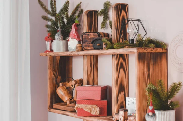 Christmas decor on a wooden shelf. New Year and Christmas decorations