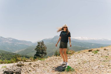 Young woman in hat standing on Mountain View.