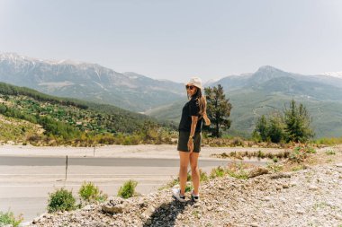 Young woman in hat standing on Mountain View.