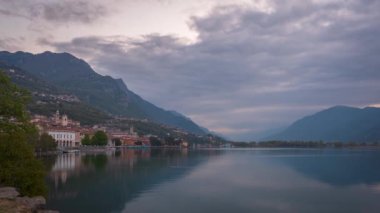 Timelapse of Lake Iseo at sunrise, on the left the city of lovere which runs along the lake,Bergamo Italy.