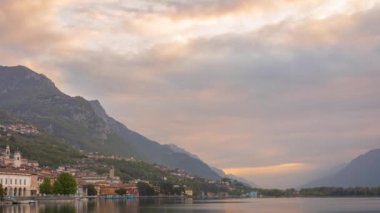 Timelapse of Lake Iseo at sunrise, on the left the city of lovere which runs along the lake,Bergamo Italy.