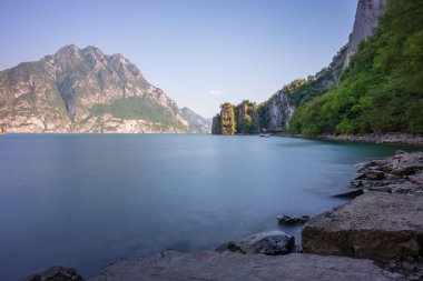 Awesome view of mountains and lake iseo from Riva di Solto,long exposure photo, Baia dal Bogn,Bergamo,Italy.