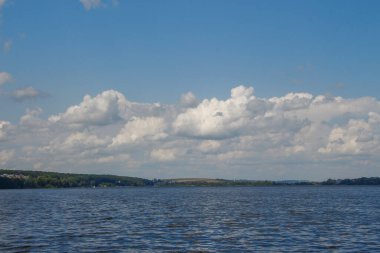 Autumn white clouds on a blue sky in August
