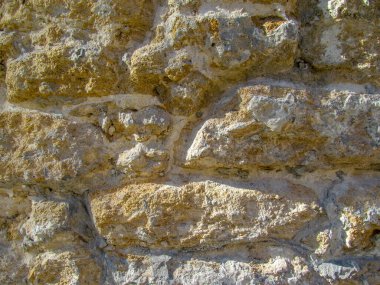 Duvardaki sarı kumtaşı dokusu