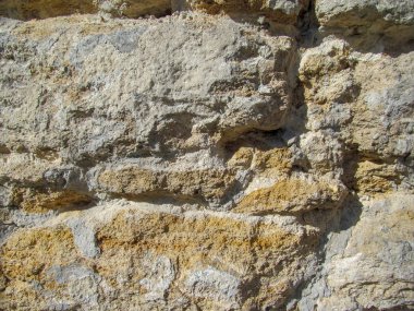 Duvardaki sarı kumtaşı dokusu