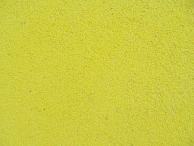 Arkaplan için sarı alçılı duvar dokusu