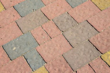 Arka planlar için sokakta renkli beton kaldırım dokusu