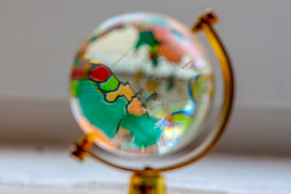 Toy globe made of glass on the table