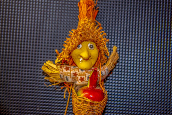 Toy flying witch or Baba Yaga in a hat and in a basket