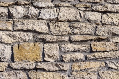 Duvardaki sarı kumtaşı dokusu