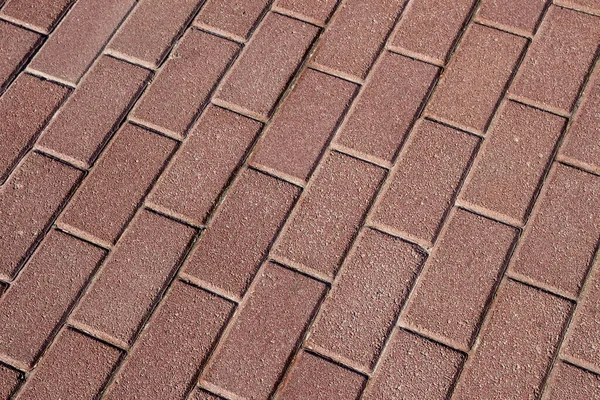 Parke taşlarının dokusu arka planlar için yere serilmişti.