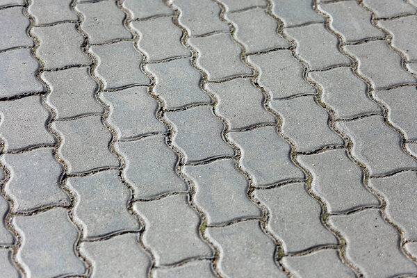 Colored cobblestone texture for backgrounds. Concrete pavement on the sidewalk.