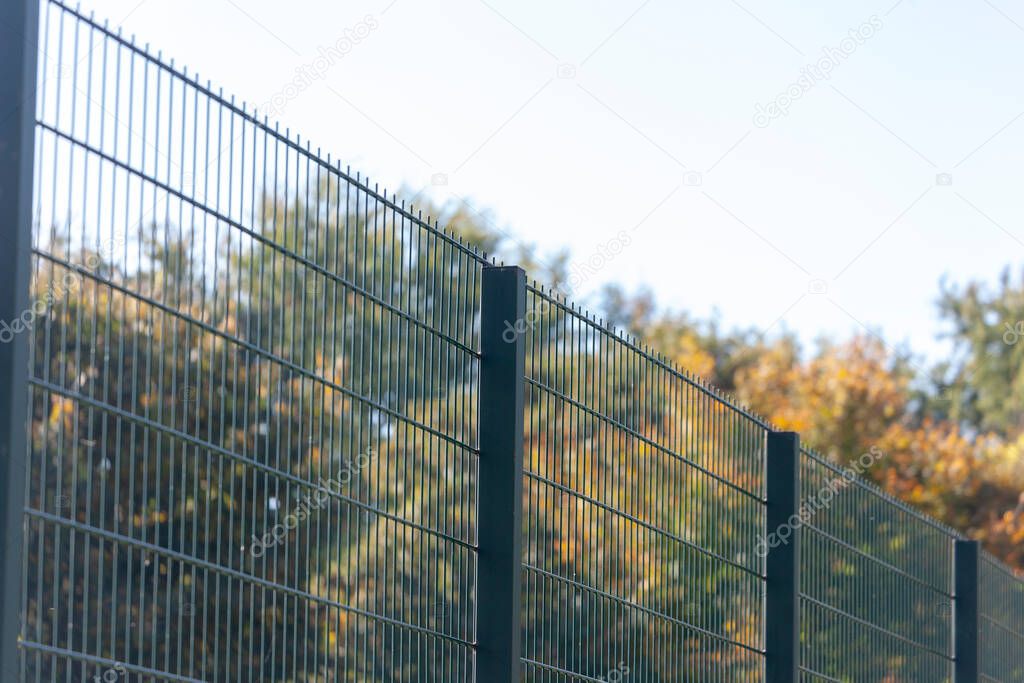 Texture of cradled metal or synthetic mesh on the fence for backgrounds