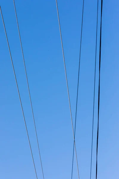 Ηλεκτρικές Γραμμές Φόντο Γαλάζιου Ουρανού — Φωτογραφία Αρχείου