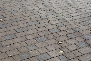 Arka plan için renkli kaldırım taşlarının dokusu. Kaldırımda beton kaldırım