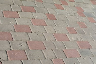 Arka plan için renkli kaldırım taşlarının dokusu. Kaldırımda beton kaldırım