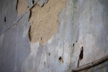 Eski bir duvarın dokusu ve terk edilmiş bir evde kumtaşı.