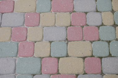 Arkaplan için parktaki renkli kaldırım taşlarının dokusu