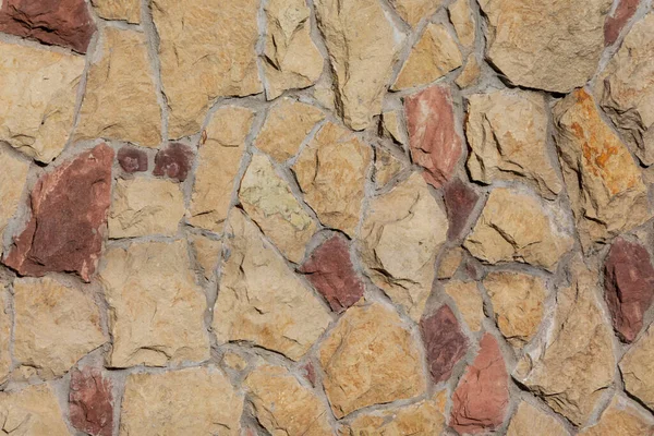 黄色の石を背景にした石垣の質感 — ストック写真