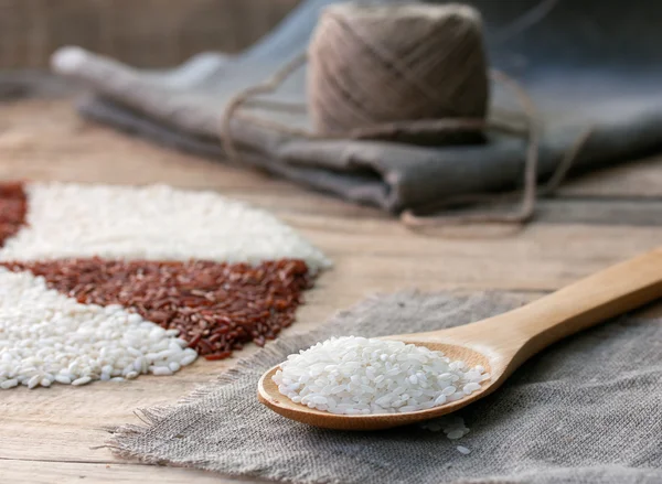 White rice in a wooden spoon — Stock Photo, Image