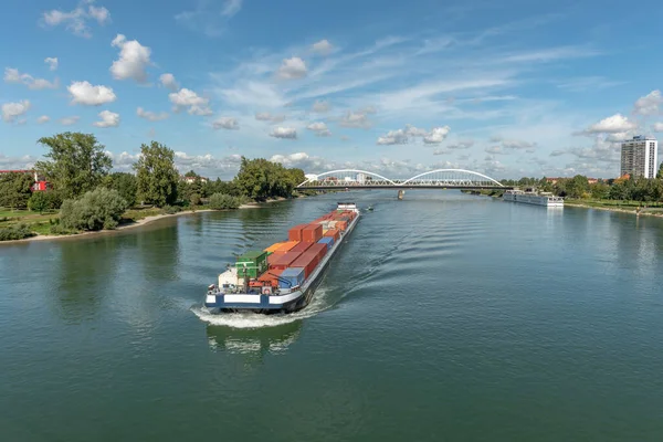 Barge transporting goods on the Rhine between France and Germany. Strasbourg, Kehl.