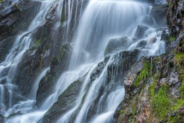 Waterfall on a mountain stream in spring. Vosges, France, Europe.