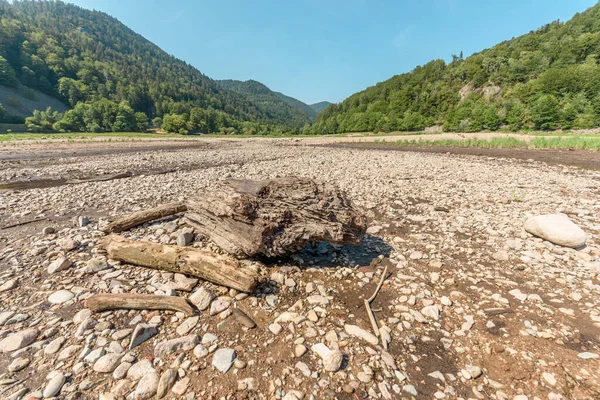 Water level drops in mountain lake in summer. Wildenstein, Vosges, Alsace, France.