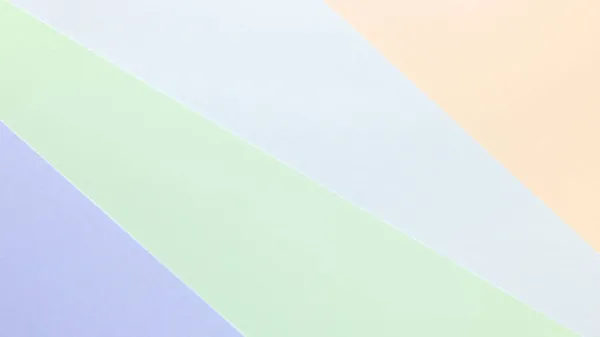Hintergrund in trendigem mehrfarbigem Papier. Draufsicht. Minimales Konzept. lizenzfreie Stockfotos