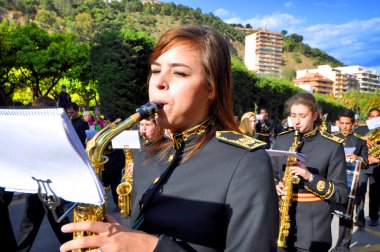MALAGA, SPAIN - APRIL 09: Nazarenes and musicians from Semana Sa clipart