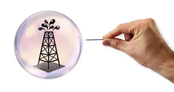 Oil value Bubble about to explode by a needle — Stock Photo, Image