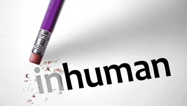 Eraser changing the word Inhuman for human — Stock Photo, Image