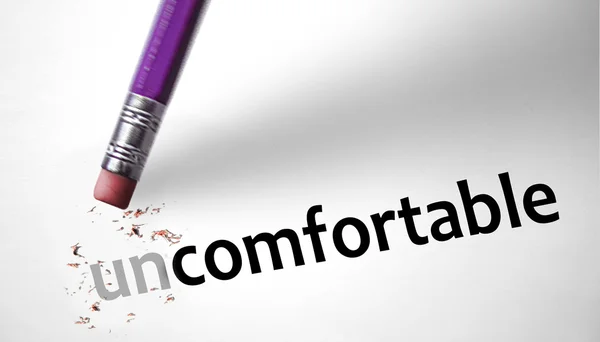 Eraser changing the word Uncomfortable for Comfortable — Stock Photo, Image