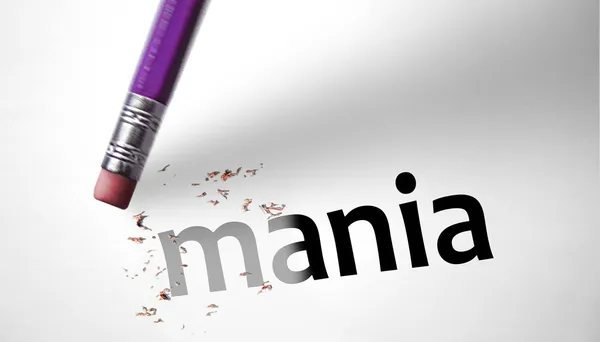 Eraser deleting the word Mania — Stock Photo, Image