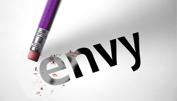 Eraser deleting the word Envy 