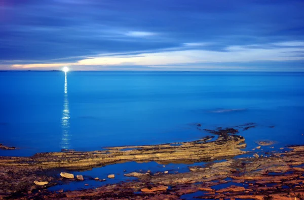 Lighthouse at dusk, in a long time exposure (England)