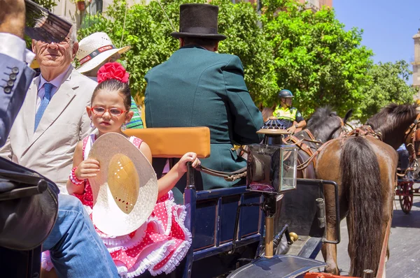 MALAGA, ESPAÑA - 14 DE AGOSTO: Jinetes y carruajes en la Feria de Agosto de Málaga el 14 de agosto de 2009 en Málaga, España — Foto de Stock