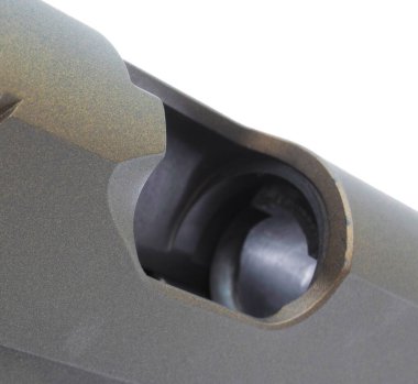 Empty chamber on a semi-automatic gun isolated on white