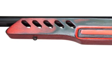 Rifle with ventilation holes in its red laminated fore end isolated on white