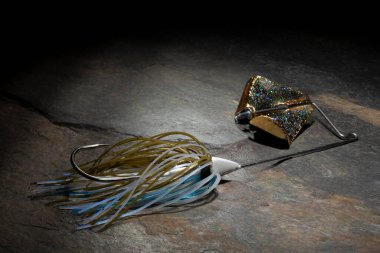 Buzzbait for largemouth bass with a blue and brown skirt