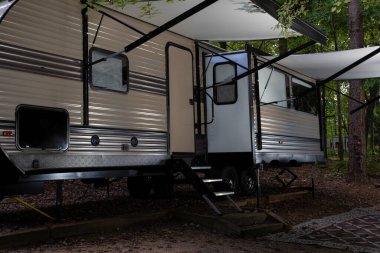 Travel trailer with awnings out at a North Carolina camping area