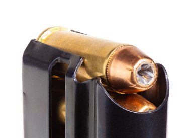 Self defense bullets in a pistol magazine isolated on white