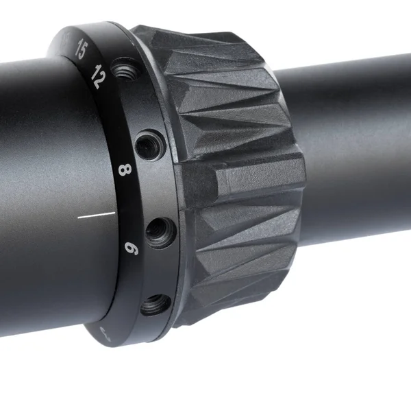 Dial to change magnification on a scope for a rifle isolated on white