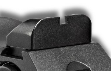 Beyaz arka planı olan bir tabancada arkadan görüş ve gölge.