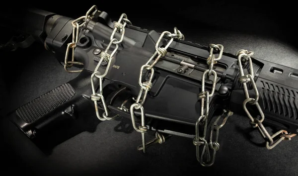 AR-15 with chain wrapped around to keep it safe