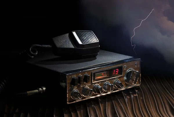 Two way radio on channel 13 with lightning behind