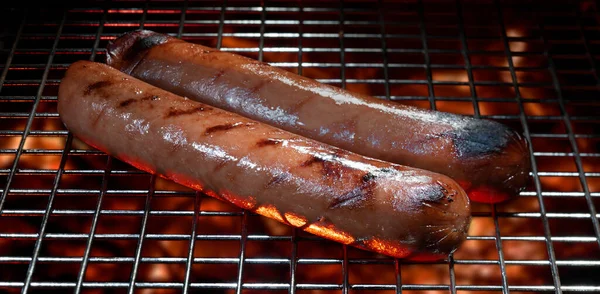 Two Hot Dogs Sizzling Grill Hot Coals — Stock Photo, Image