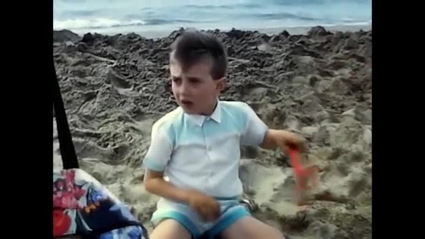 Diano Marina Italy June 1980 Child Plays Sand Sea 80S — стоковое видео